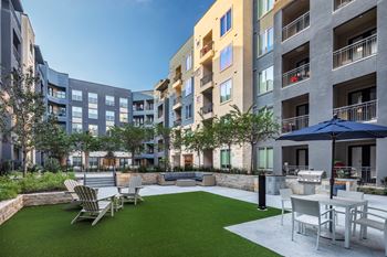 Aura thirty2 new apartments in austin, texas courtyard